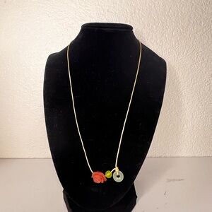 Elegant Gold Necklace with Red and Green Accents